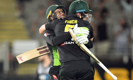 Alex Carey and Aaron Finch embrace to celebrate Australia’s record-breaking victory. 