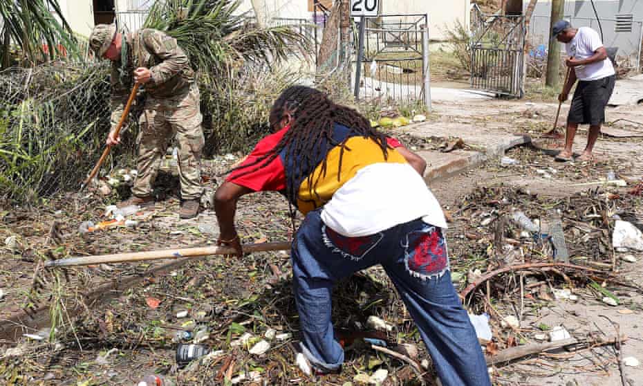 British army commandos and local residents take part in recovery efforts after Hurricane Irma passed Tortola, in the British Virgin Islands.