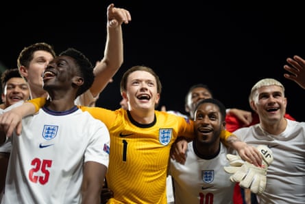 Adam Hugill as Harry Maguire, Abdul Sessay as Bukayo Saka, Josh Barrow as Jordan Pickford, Edem-Ita Duke as Marcus Rashford, Francis Lovehall as Raheem Sterling and Alfie Middlemiss as Phil Foden celebrating on the pitch