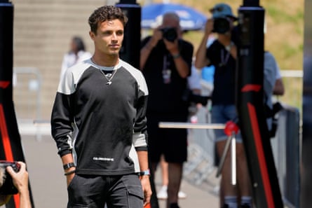 Lando Norris walking in the paddock at the Red Bull Ring racetrack in Austria.