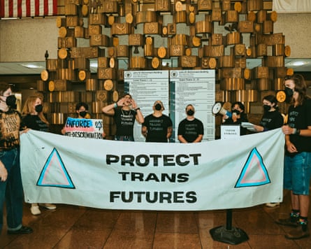 a sign that says “Protect Trans Futures”