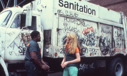 Artist Mierle Ukeles shakes hands with a sanitation worker