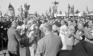 Alfa’s Giuseppe Farina receives the trophy after winning the race.