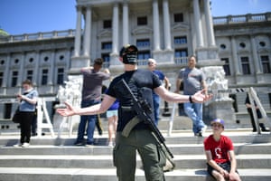 Armed protesters have become a familiar site at state capitols in recent weeks.