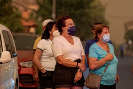 A small group of women wearing face masks.