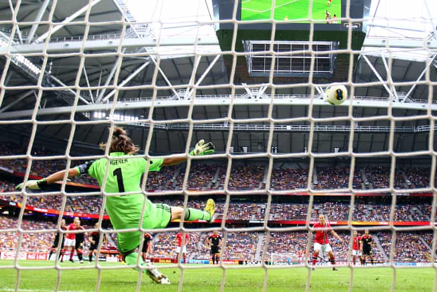 Nadine Angerer saves a penalty from Norway’s Trine Roenning during the Euro 2013 final.