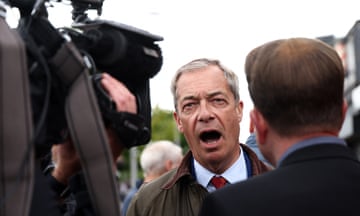 Farage speaking in front of cameras