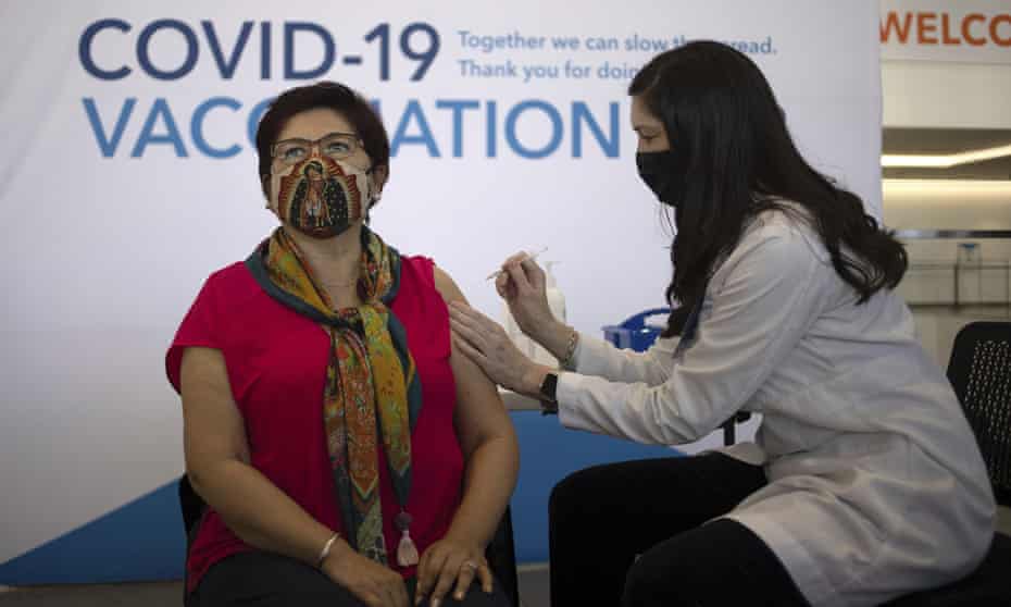 Irene Villa receives a Covid vaccine from Jamie Rant at the Moscone Center in San Francisco. 
