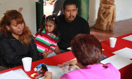 A family who returned from California after the father, right, was deported, try to get their children’s US birth certificates stamped by Mexican authorities in Malinalco, Mexico.