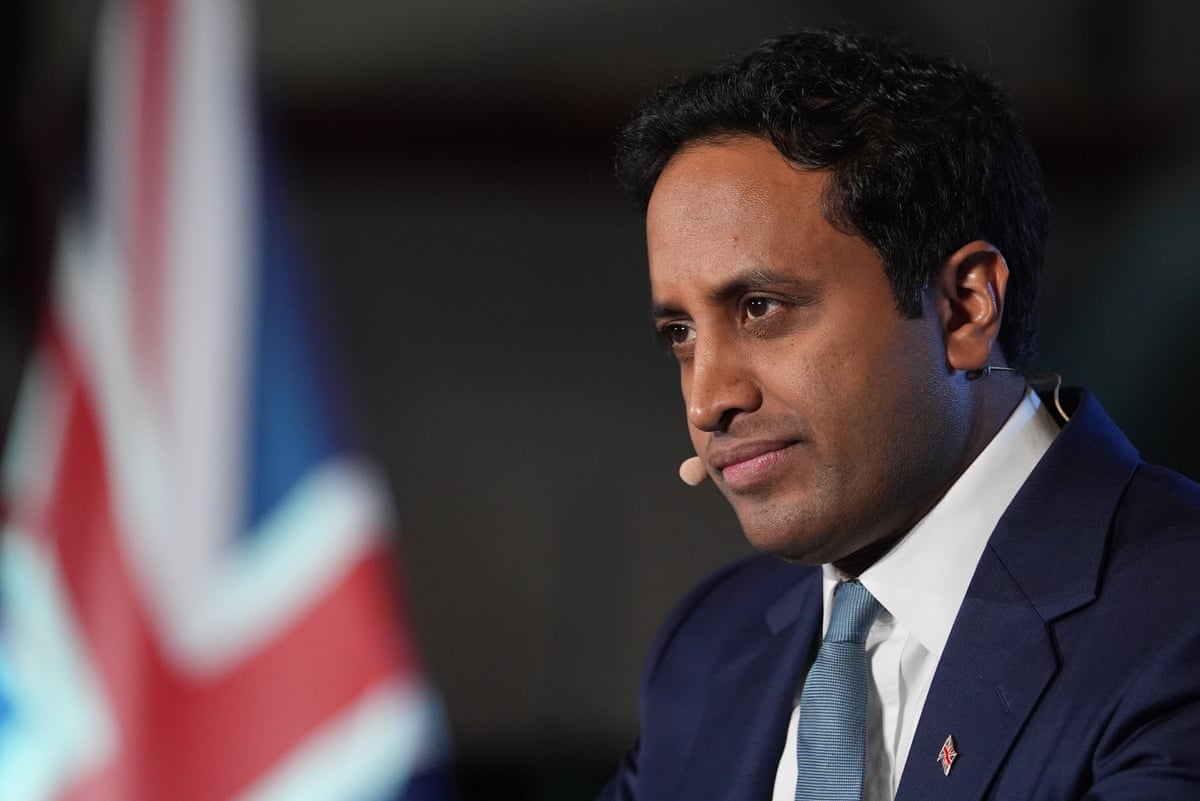 Zia Yusuf in front of a union flag