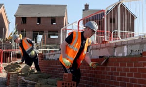 Bricklayers on a Barratt Homes development site last year.