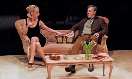 Claudie Blakley and David Morrissey sit together on a couch in The Lover/The Collection.