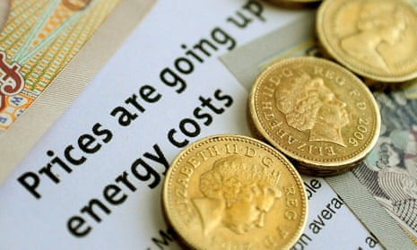 Pound coins sit on an electricity bill