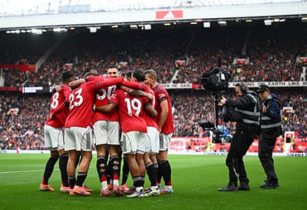 TV cameras capture Manchester United players’ celebrations.