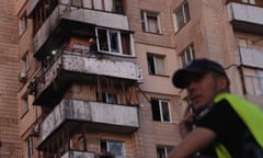 Rescuers work to secure an apartment building after a fire following a rocket strike in Kyiv, amid the ongoing invasion of Ukraine from Russia