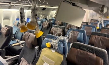 The interior of Singapore Airlines flight SQ321 is pictured after an emergency landing at Bangkok's Suvarnabhumi International Airport. The airline has offered $10,000 in compensation for those with minor injuries