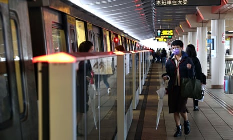 People wear protective masks on metro in Taipei, Taiwan