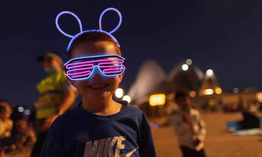 A child ready for fireworks at the Sydney Opera House
