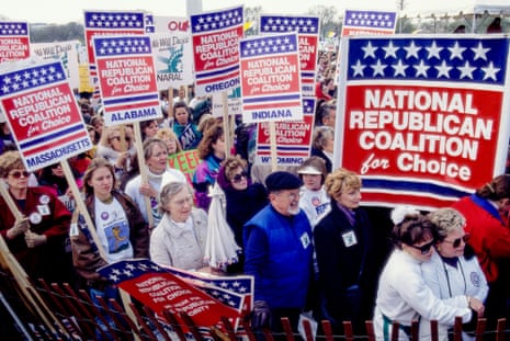 People hold signs that read "national republican coalition for choice"