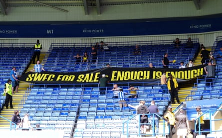 Sheffield Wednesday fans in the stands protest against club owner Dejphon Chansiri