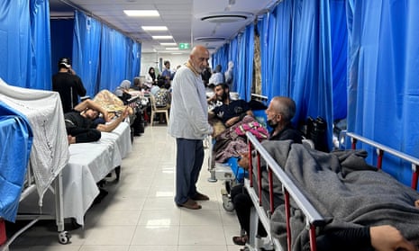Patients and internally displaced people at Shifa hospital in Gaza City on Friday.