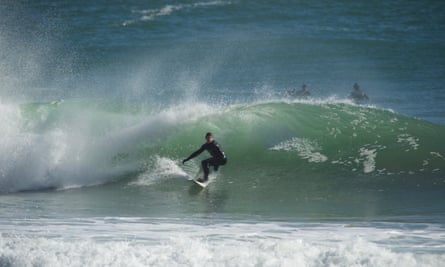 Andy Ainscough from Adventure Parcs winter surfing in Pembrokeshire.