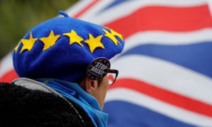 A man wearing a hat bearing the stars of the EU