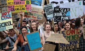 Students take part in a climate rally in Parliament Square, London
