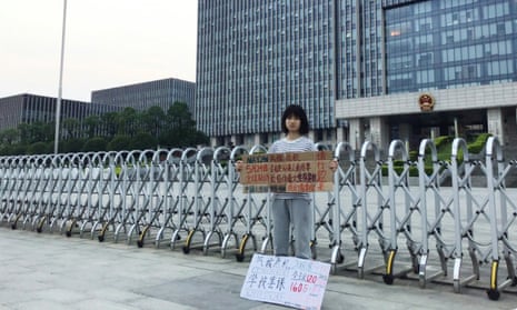 Howey Ou protesting outside government offices in Guilin, southern China