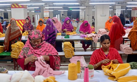 In this photograph taken on April 13, 2023, women work at a garment factory in Savar, on the outskirts of Dhaka.