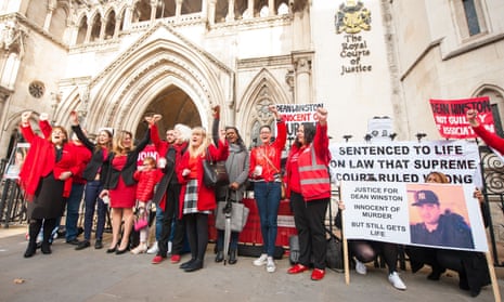 Members of the campaign group Jengba (Joint Enterprise Not Guilty by Association) demonstrate against joint-enterprise convictions outside the Royal Courts of Justice in London in 2021.