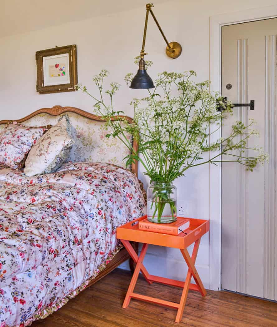 The master bedroom in the home of fashion designers Justin Thornton and Thea Bregazzi in Walberswick, Suffolk