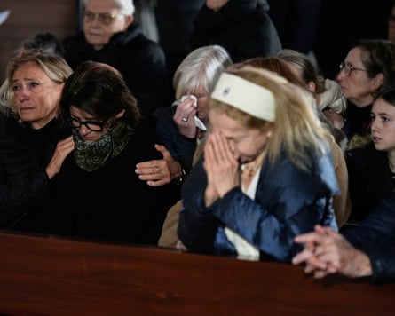 People sitting in the pews of a church