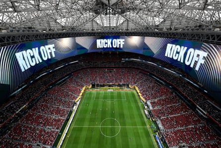 An aerial view of Mercedes-Benz Stadium with “Kick Off” displayed on video boards.