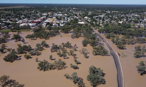 Aerial view of flood water around a road and a town