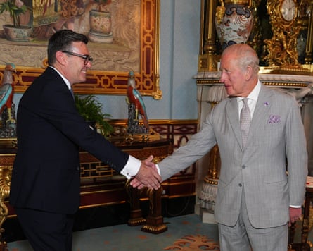 King Charles III shakes hands with Andy Burnham during an audience at Buckingham Palace, where he invited the leader of the Labour Party to become prime minister and form a new government.