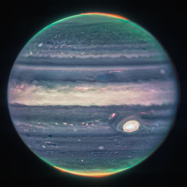 A NASA image shows an artificially colored composite of Jupiter obtained by the James Webb Space Telescope