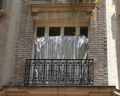 Some residents cover their apartment windows with aluminum foil to keep their homes cooler, particularly in older buildings with zinc roofs.