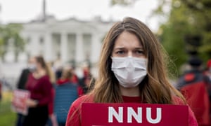 A member of National Nurses United (NNU) demonstrates outside the White House in April amid calls for adequate personal protective equipment.
