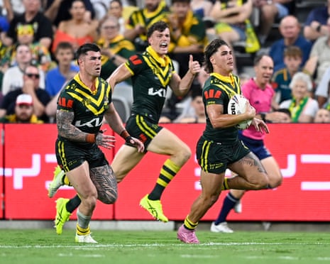 Reece Walsh runs the ball as AustraliaâÂÂs Kangaroos shake off an early scare to defeat Cook Islands in their menâÂÂs Rugby League World Cup clash in Townsville