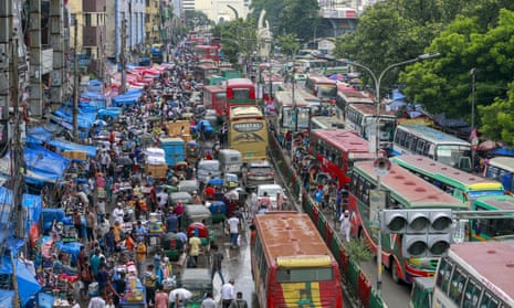 Vehicles and pedestrians jam the streets of Dhaka, Bangladesh, in 2021. 