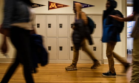 Students walk past lockers at Cardozo high school on 11 January 2018 in Washington DC.