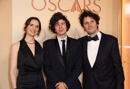 Bienvenu (centre) with Arco co-producer Sophie Mas (left) and writer-producer Félix de Givry (right) at the 98th Academy Awards, LA.
