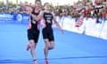 Alistair Brownlee, left, helps his brother, Jonny, reach the finish of the world triathlon series event in Mexico on 2016.