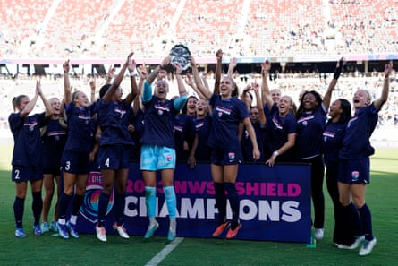 San Diego Wave goalkeeper Kailen Sheridan (centre left) and Alex Morgan (centre right) lift the trophy as they celebrate with teammates after winning the 2023 NWSL Shield.