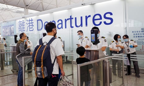 People at departure gates at Hong Kong airport
