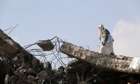 A man walks on the roof of the detention hit by airstrikes in Sa’ada province