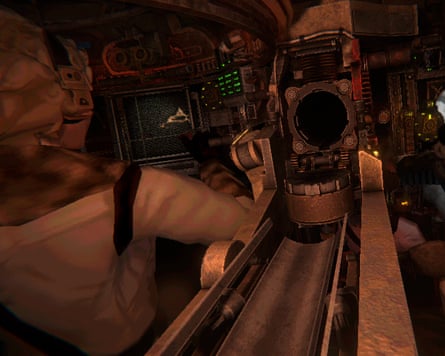 Two people sit side by side in a cramped tank interior, their hands on machinery
