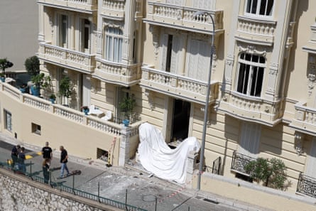 Bomb disposal officers at work outside an apartment block