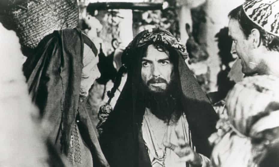 George Harrison cameos in Life of Brian, with Eric Idle and John Cleese.